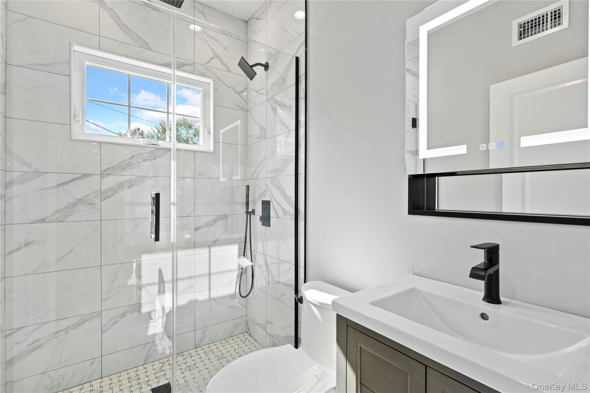 30 Virginia Road Syosset, NY 11791 - Photo 11 of 24 a bathroom with a sink toilet and shower