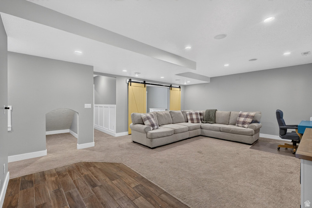 1263 East 1200th South Springville, UT 84663 - Photo 35 of 60 Recessed lighting illuminates the open-concept space featuring a combination of wood-finish flooring and neutral carpeting
