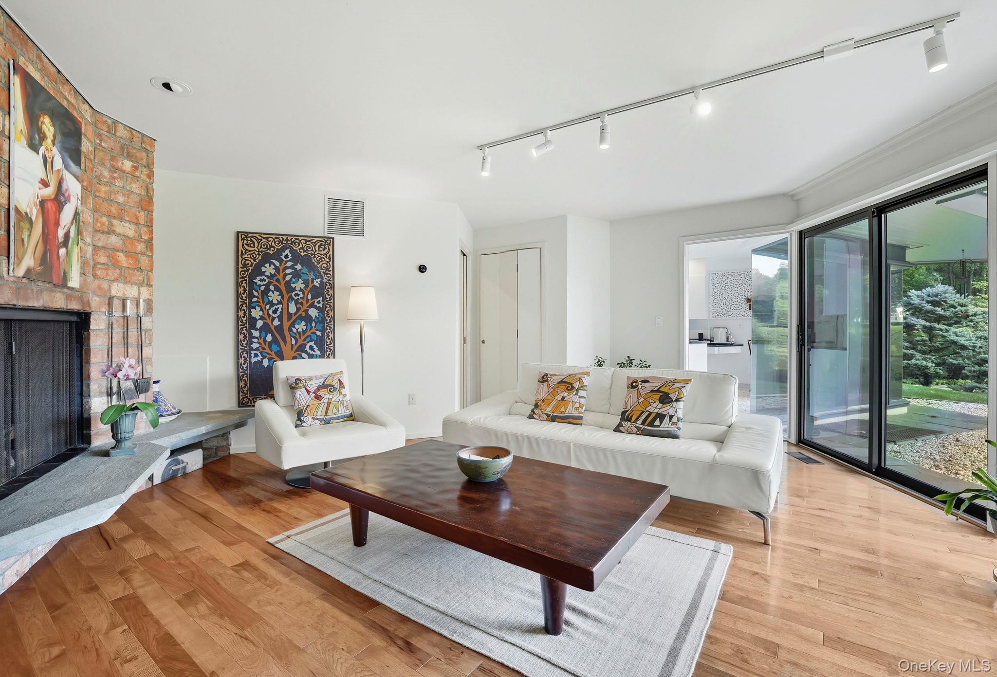 67 Banksville Road Armonk, NY 10504 - Photo 12 of 49 a living room with furniture and a large window