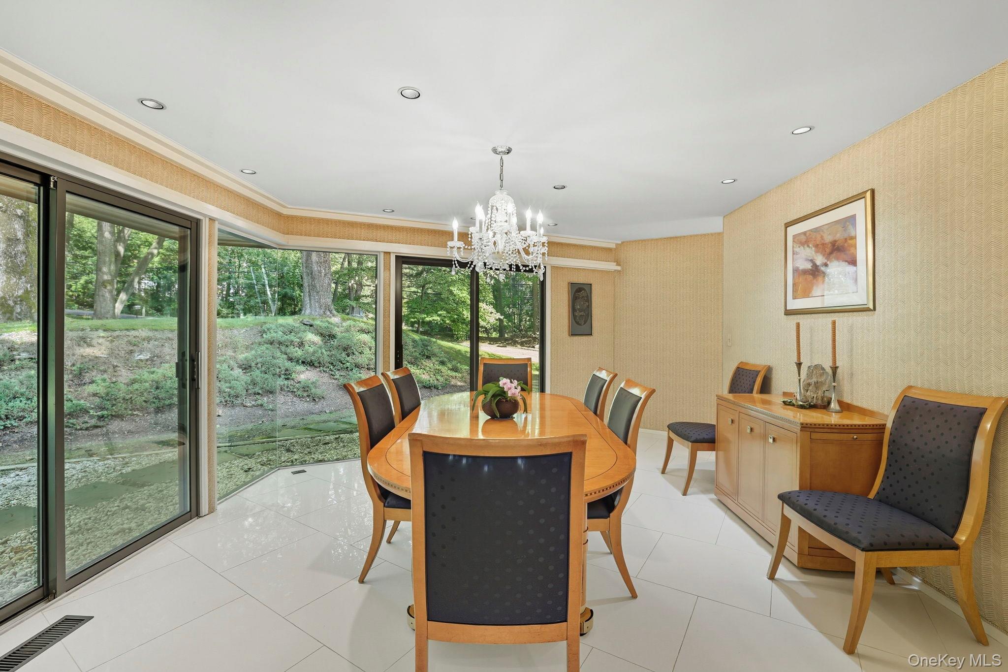 67 Banksville Road Armonk, NY 10504 - Photo 13 of 49 a dining room with furniture a chandelier and window