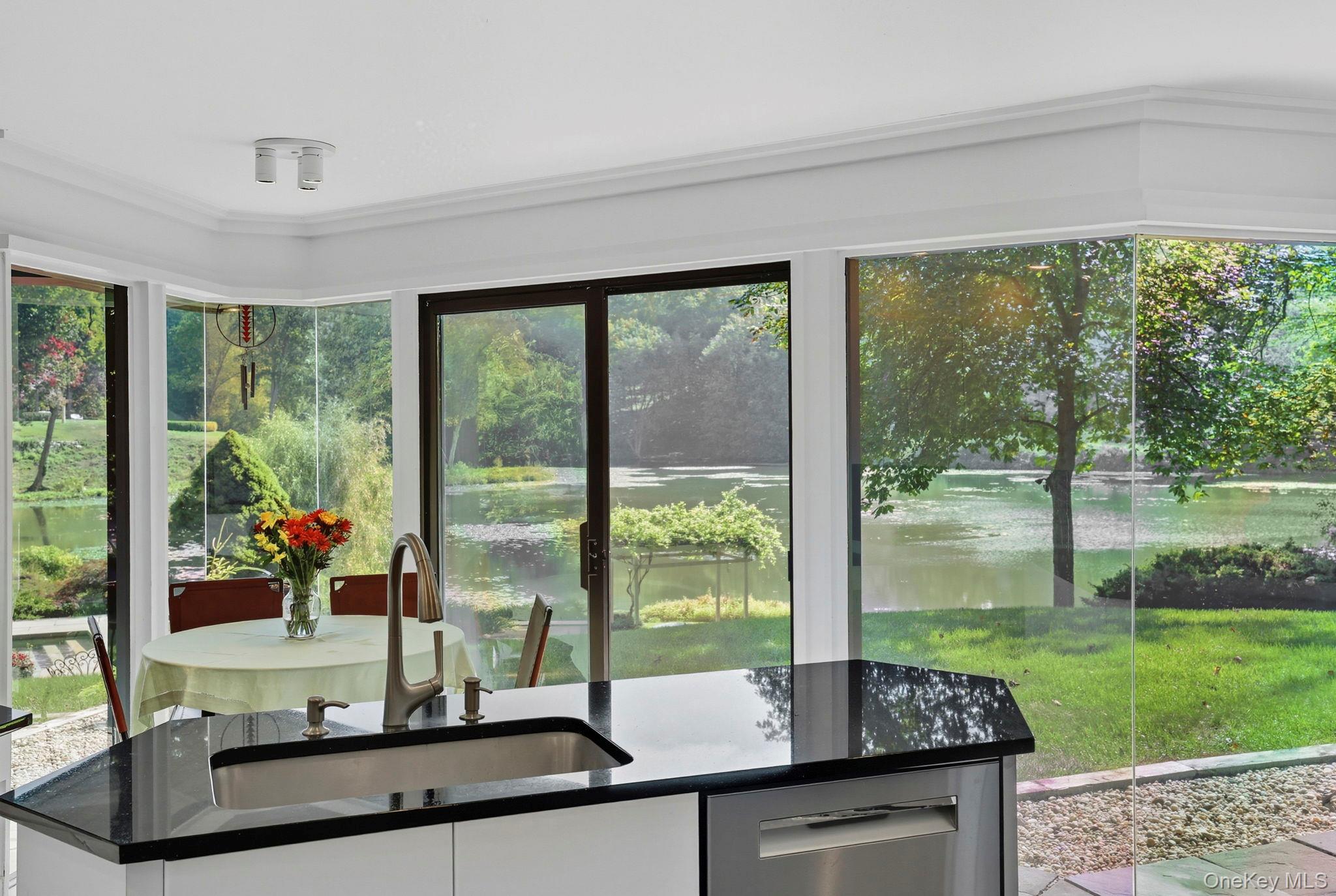 67 Banksville Road Armonk, NY 10504 - Photo 17 of 49 a view of a room with a floor to ceiling windows and a big room