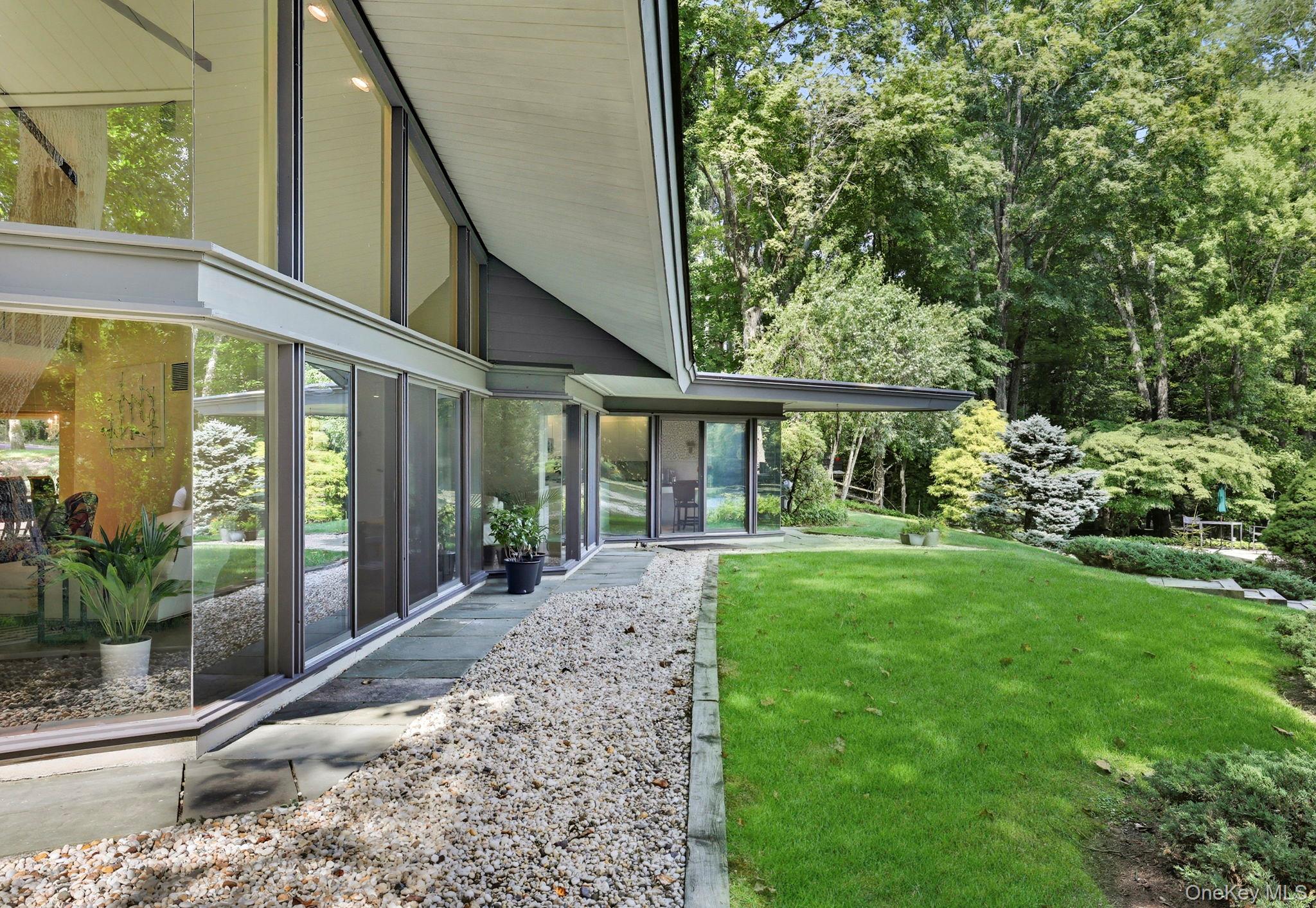 67 Banksville Road Armonk, NY 10504 - Photo 19 of 49 a view of a house with backyard and garden