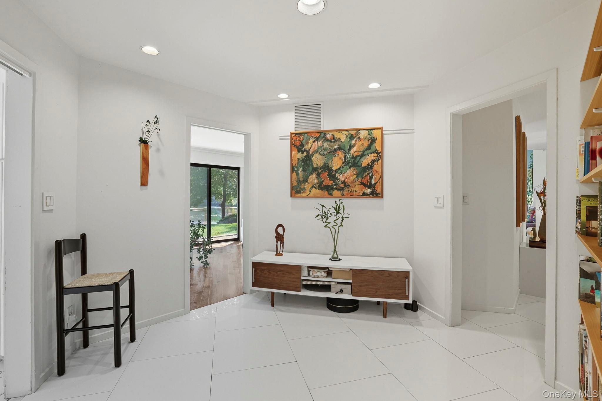 67 Banksville Road Armonk, NY 10504 - Photo 21 of 49 a living room with furniture a flat screen tv and a window