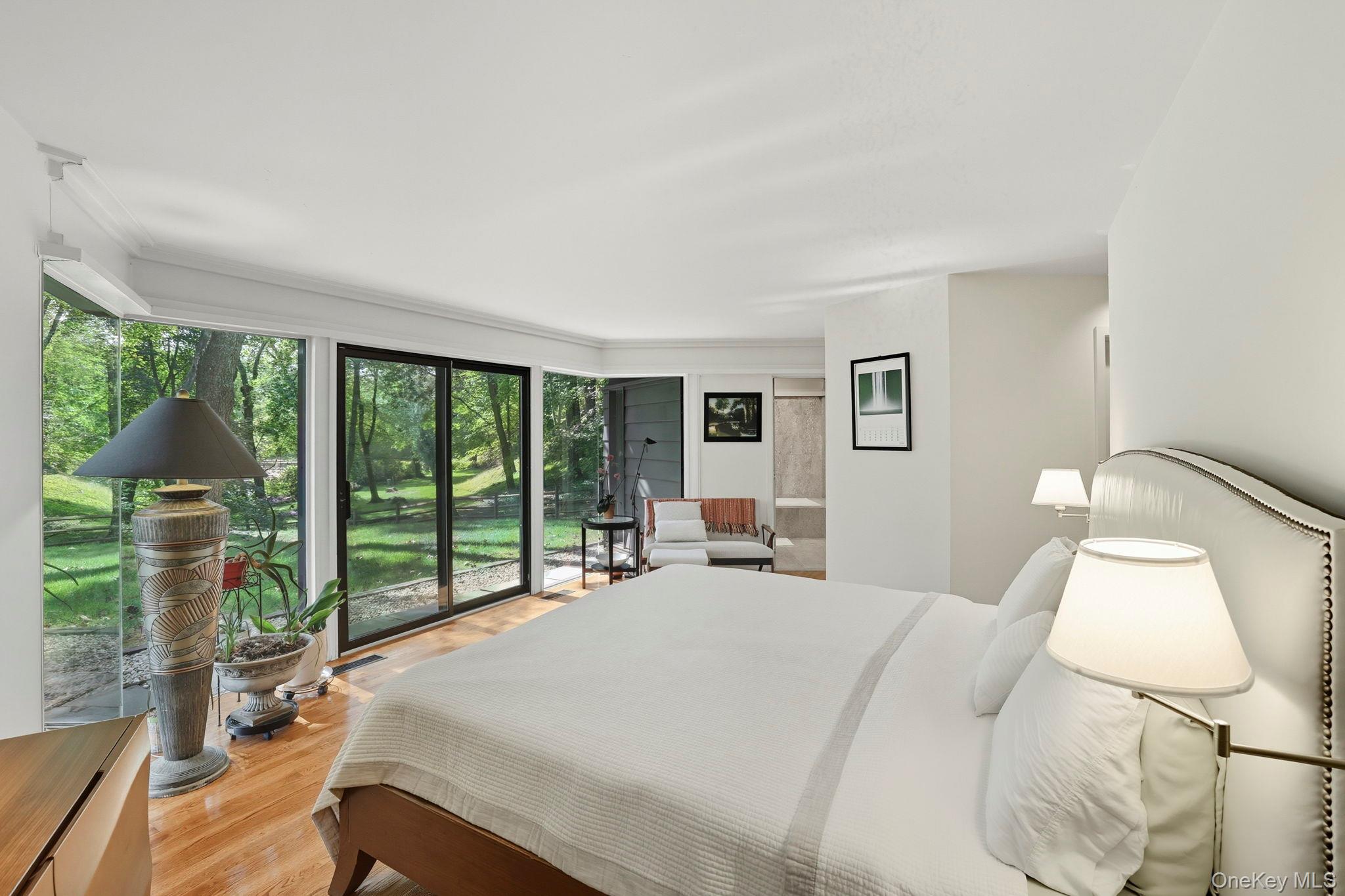 67 Banksville Road Armonk, NY 10504 - Photo 23 of 49 a bed sitting in a bedroom next to a window