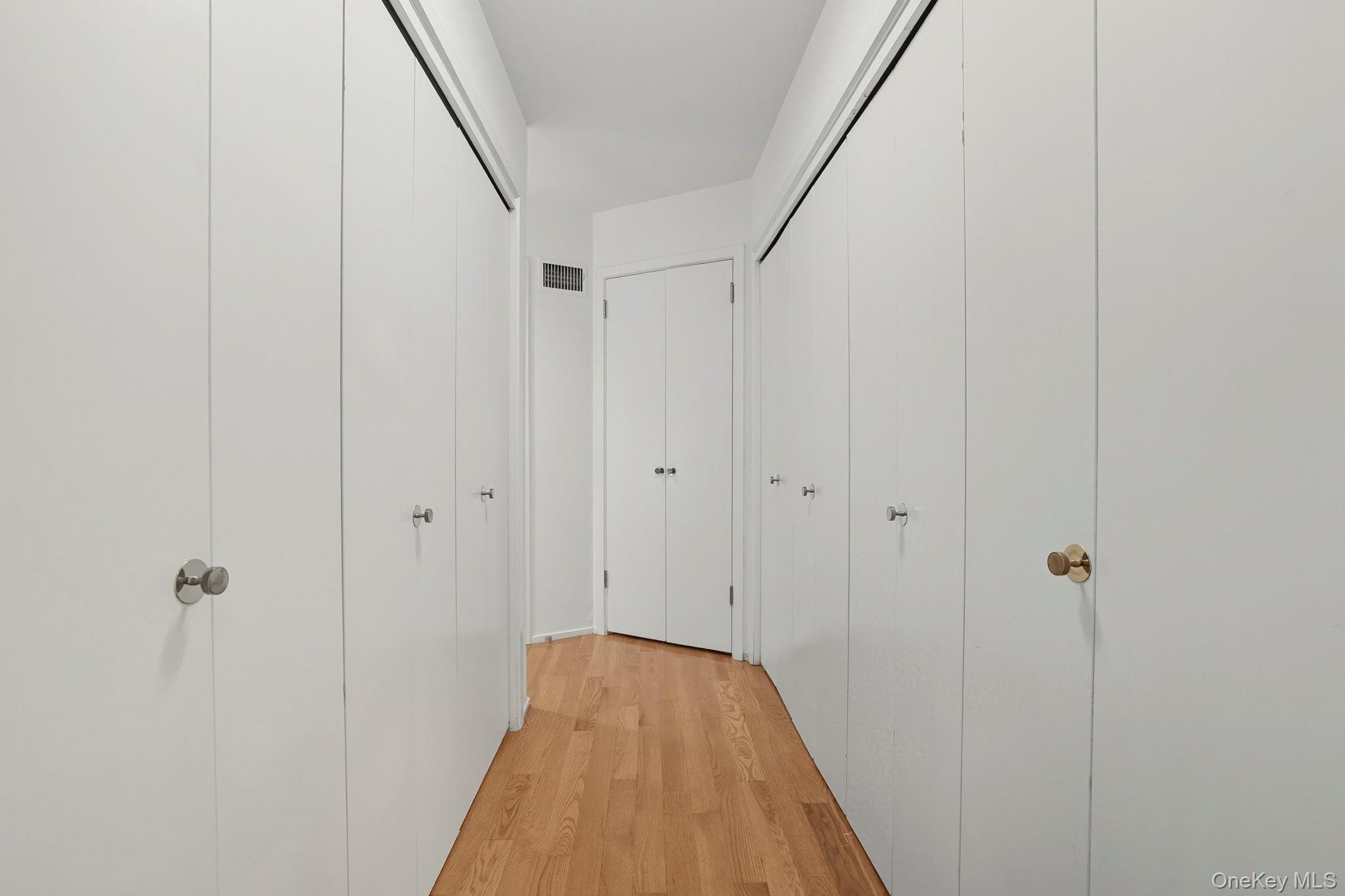 67 Banksville Road Armonk, NY 10504 - Photo 28 of 49 a view of a hallway with wooden floor and staircase