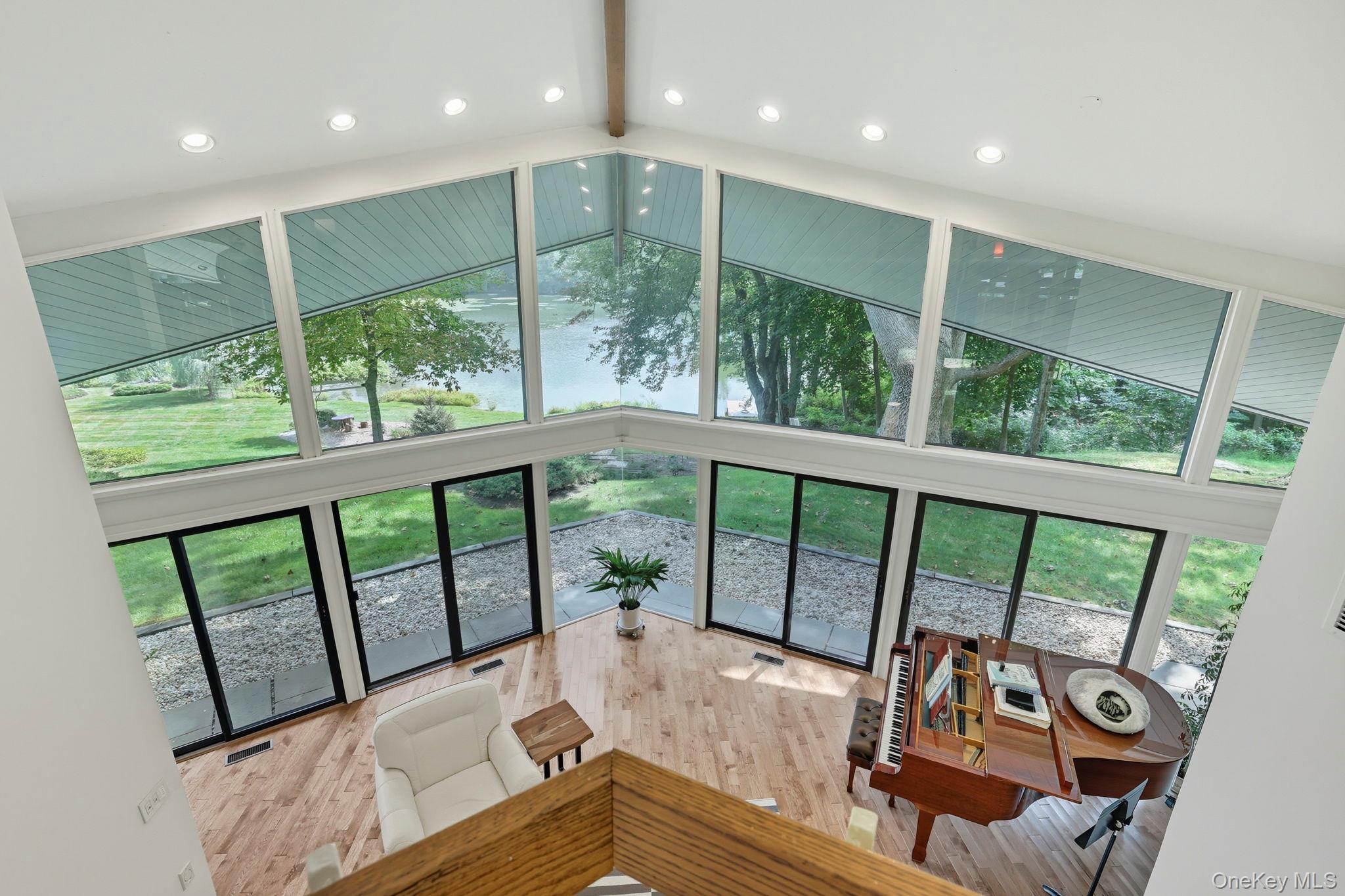 67 Banksville Road Armonk, NY 10504 - Photo 30 of 49 a living room with furniture and a large window