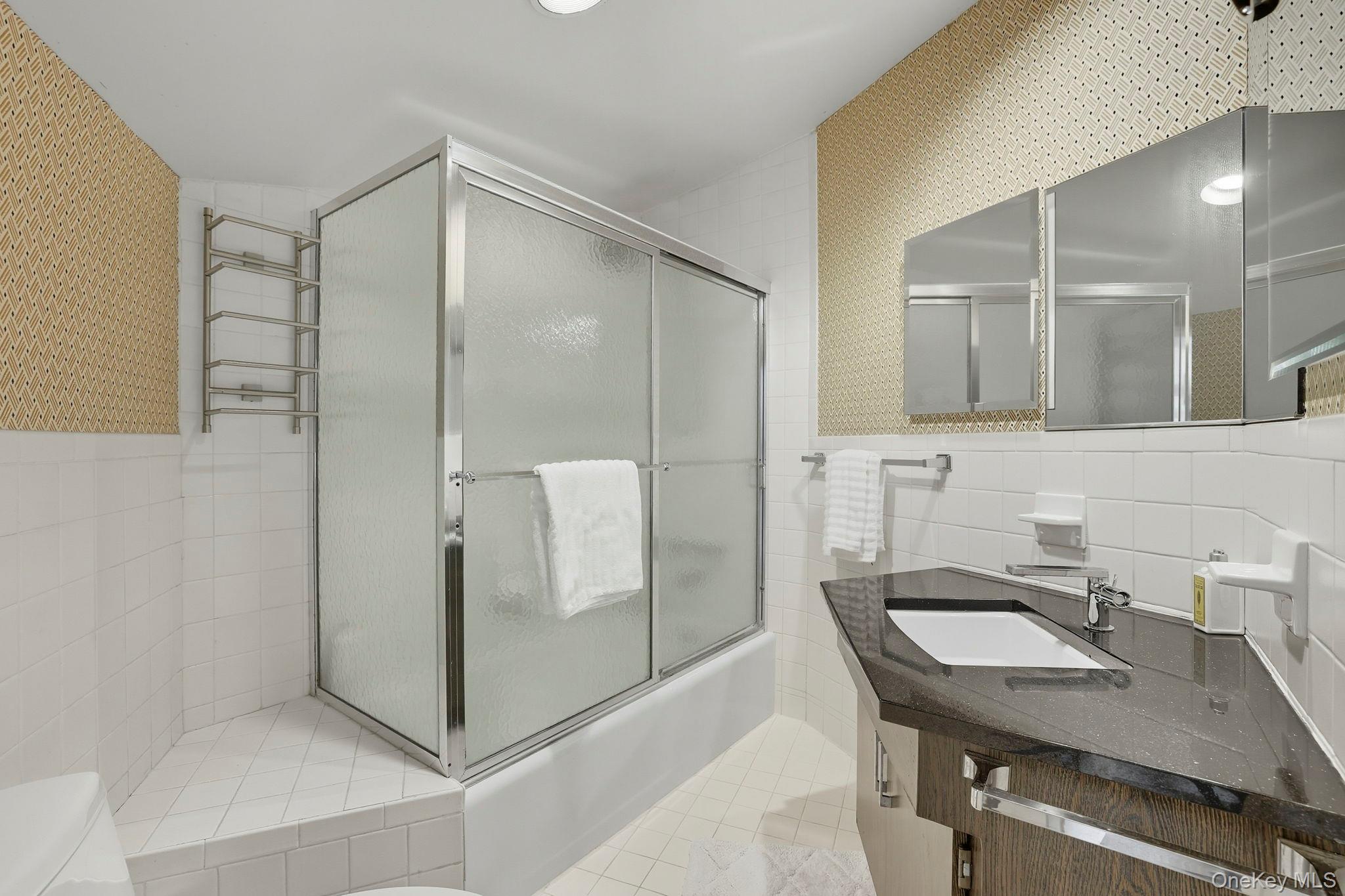67 Banksville Road Armonk, NY 10504 - Photo 35 of 49 a bathroom with a sink a mirror and a shower