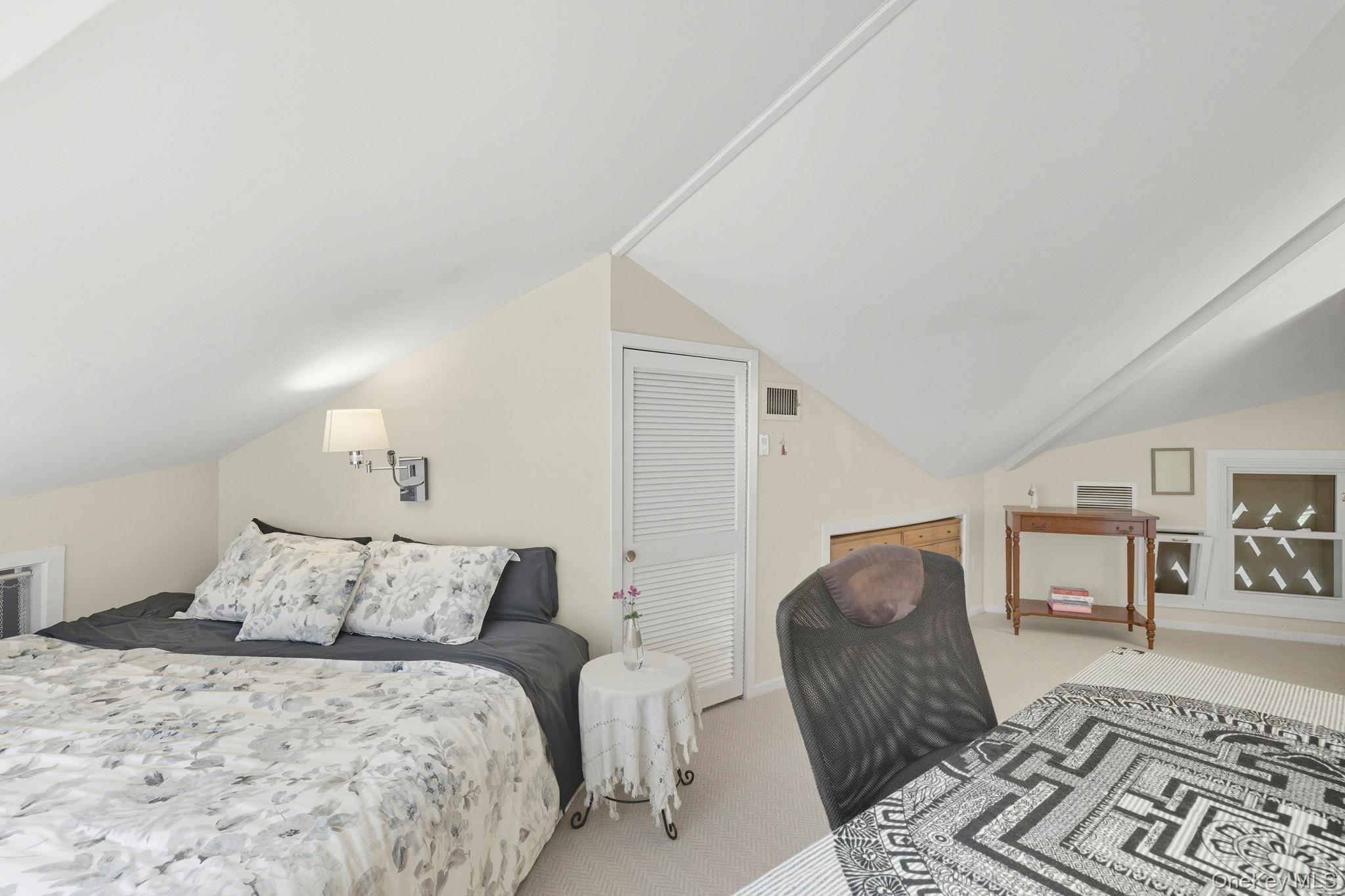 67 Banksville Road Armonk, NY 10504 - Photo 37 of 49 a bedroom with a large bed and a couch