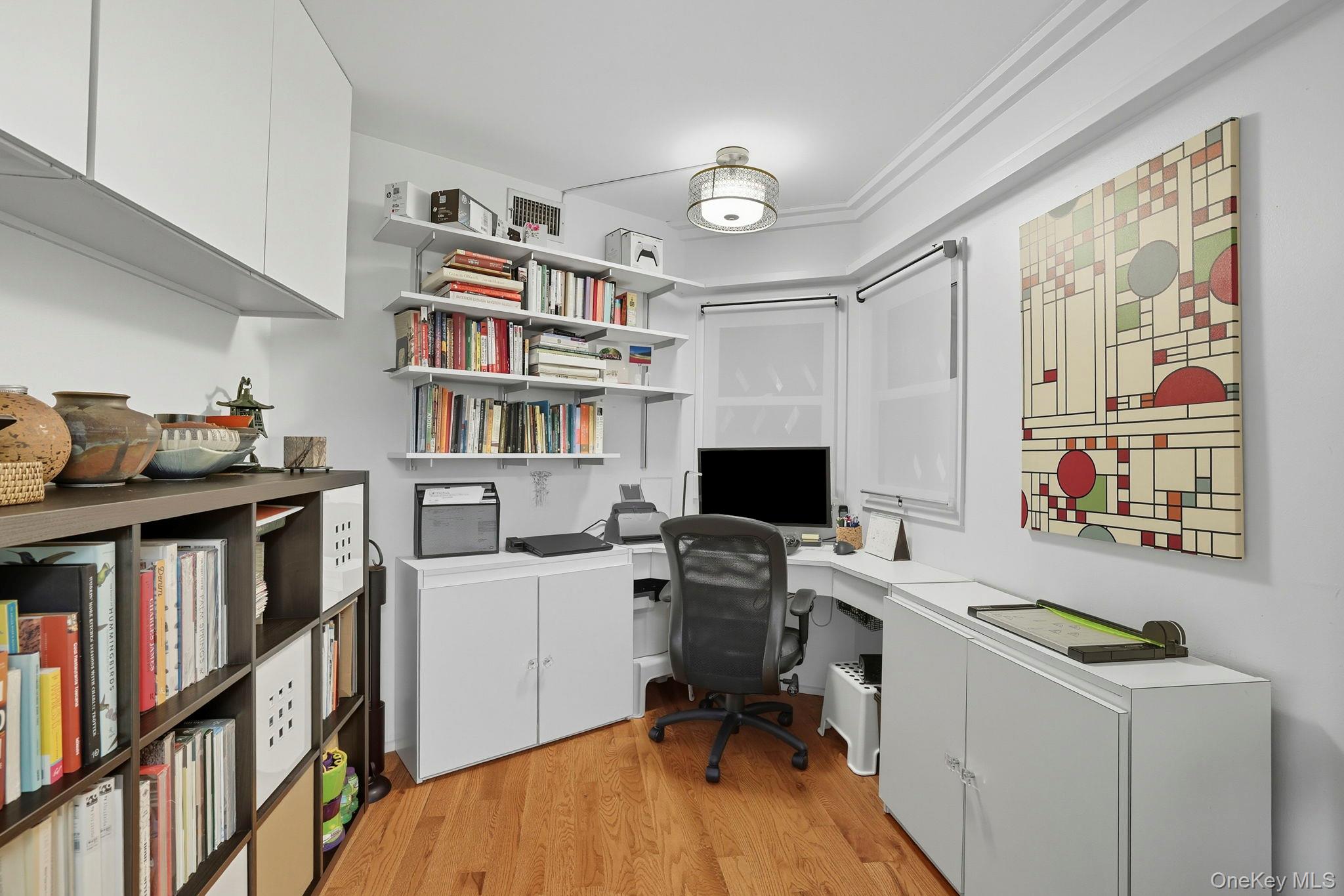 67 Banksville Road Armonk, NY 10504 - Photo 38 of 49 a view of a workspace with furniture and a bookshelf