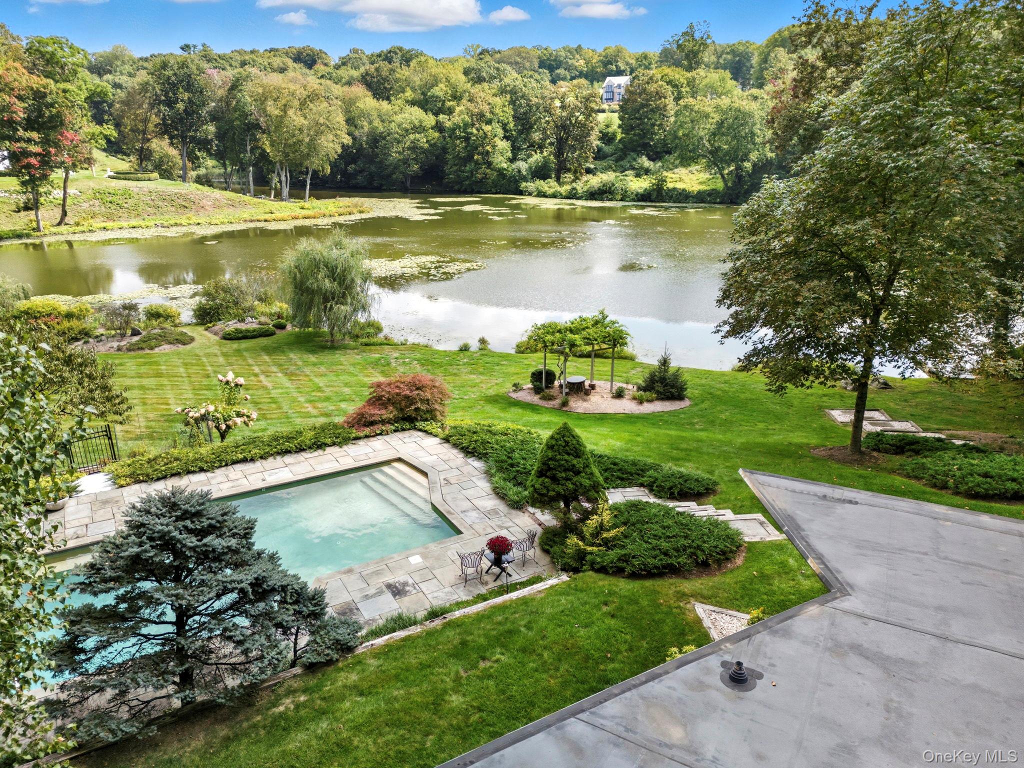 67 Banksville Road Armonk, NY 10504 - Photo 46 of 49 a view of a lake with a yard