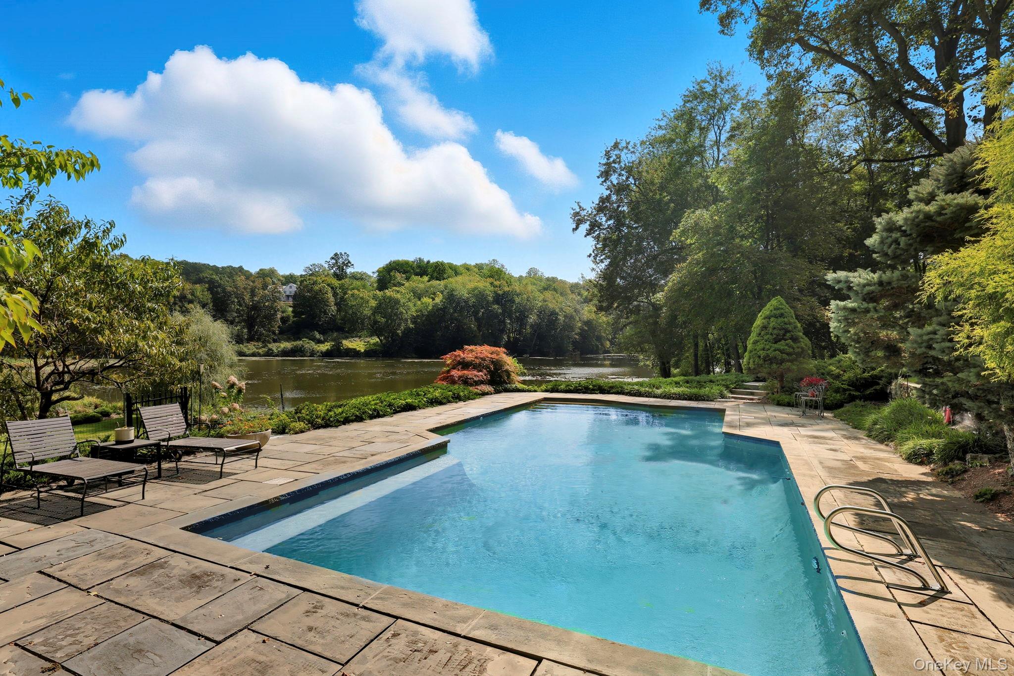 67 Banksville Road Armonk, NY 10504 - Photo 5 of 49 a view of swimming pool from a lounge chair