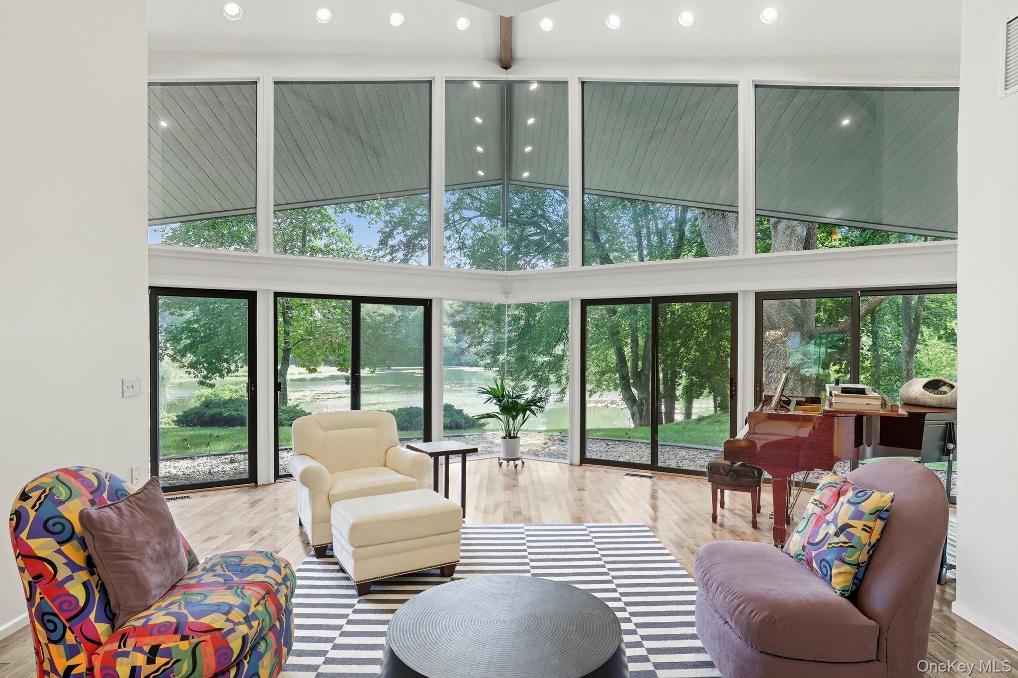 67 Banksville Road Armonk, NY 10504 - Photo 7 of 49 a living room with furniture and a large window