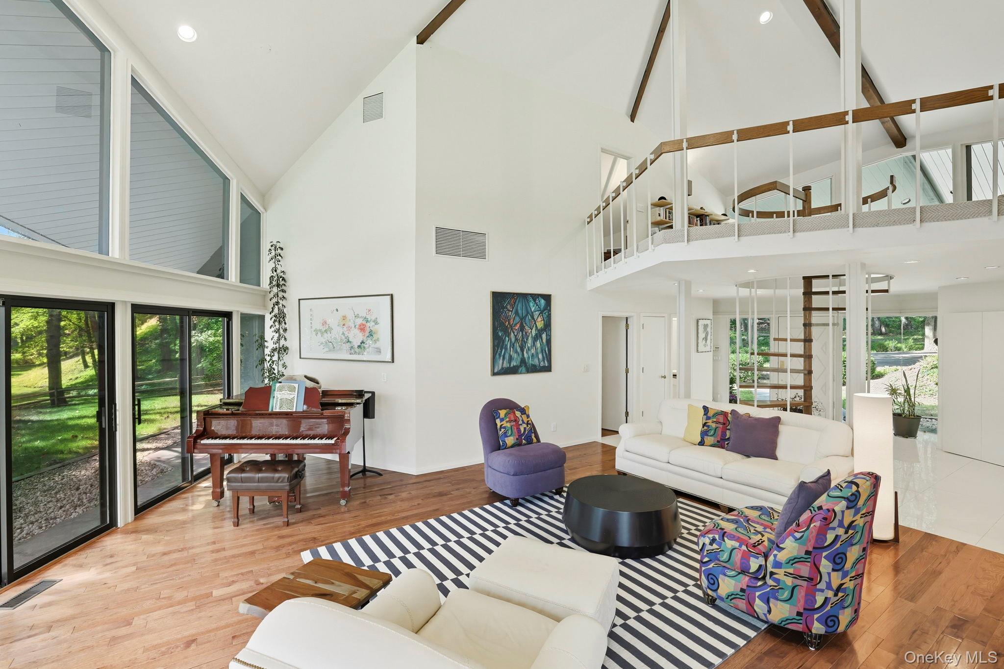 67 Banksville Road Armonk, NY 10504 - Photo 8 of 49 a living room with furniture and a floor to ceiling window