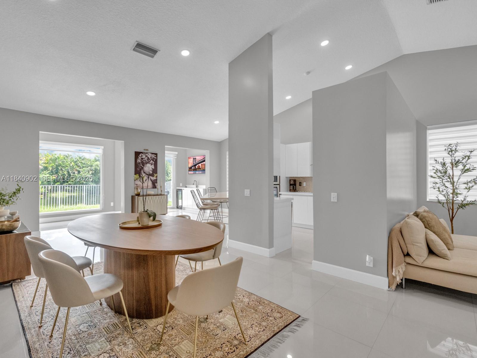 933 Falling Water Road Weston, FL 33326 - Photo 18 of 58 a view of a dining room with furniture