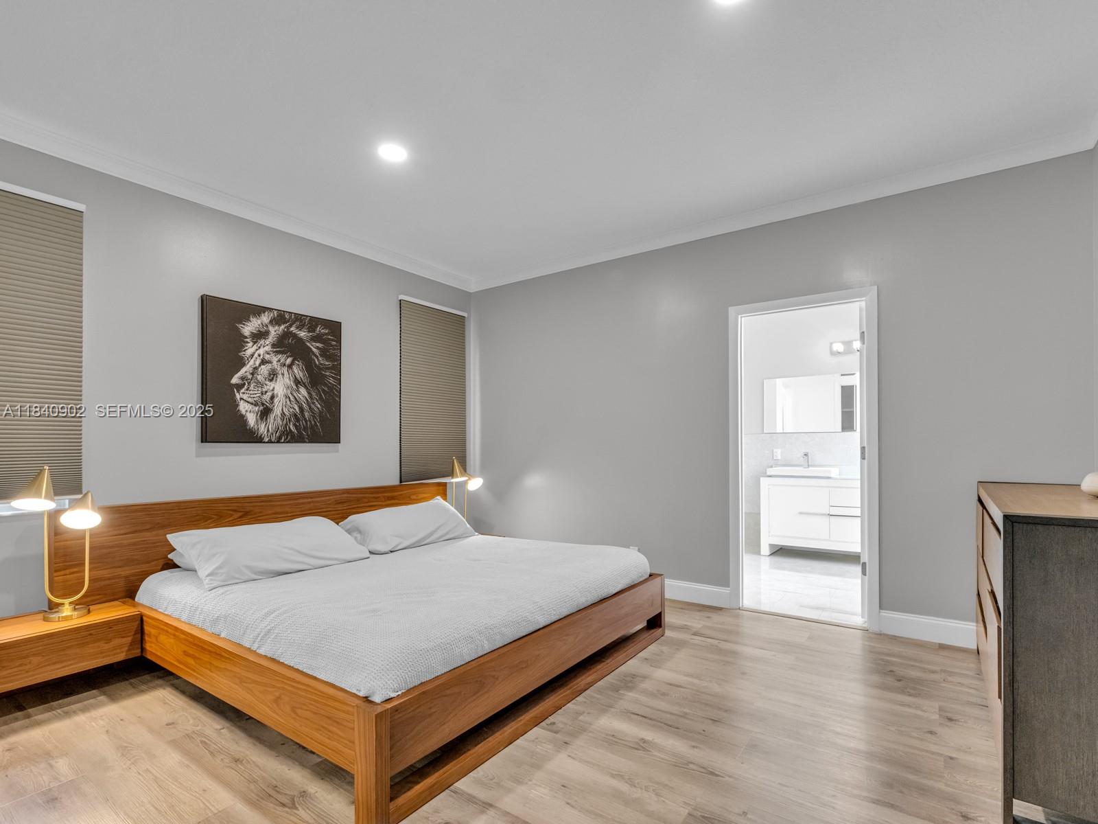 933 Falling Water Road Weston, FL 33326 - Photo 25 of 58 a bedroom with a bed and dresser