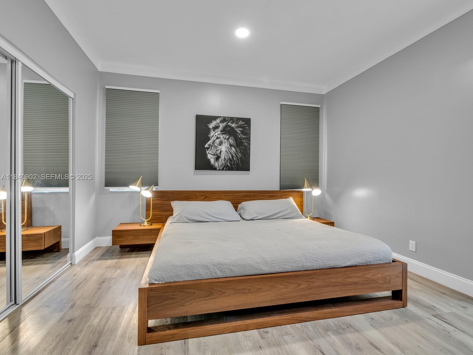 933 Falling Water Road Weston, FL 33326 - Photo 27 of 58 a bedroom with a large bed and a couch