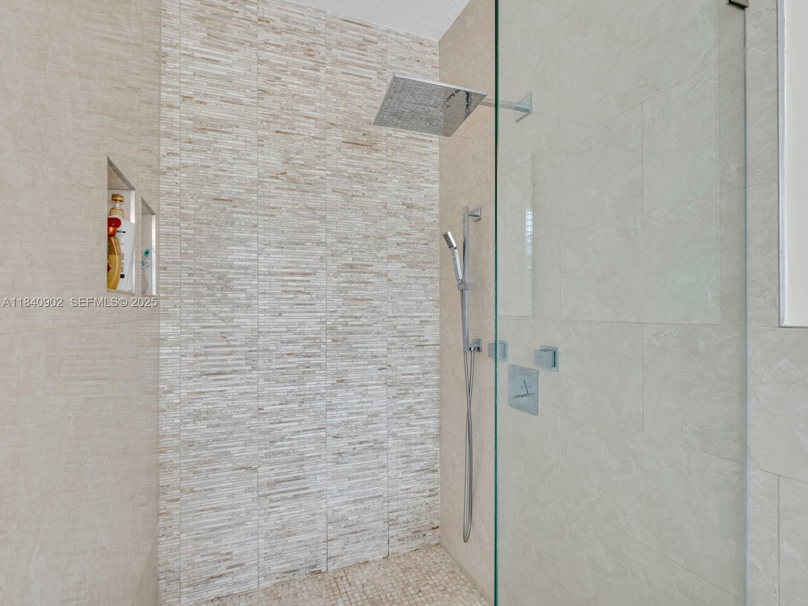933 Falling Water Road Weston, FL 33326 - Photo 31 of 58 a bathroom with a shower