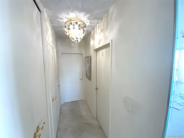 a view of a chandelier in a hallway