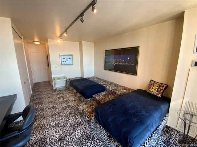 a living room with a bed and a couch