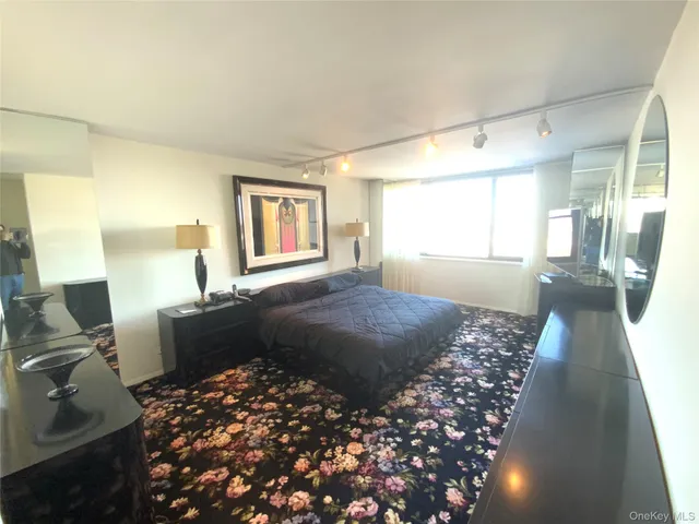 a bedroom with bed and window