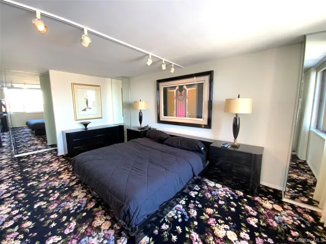 a bedroom with bed and window