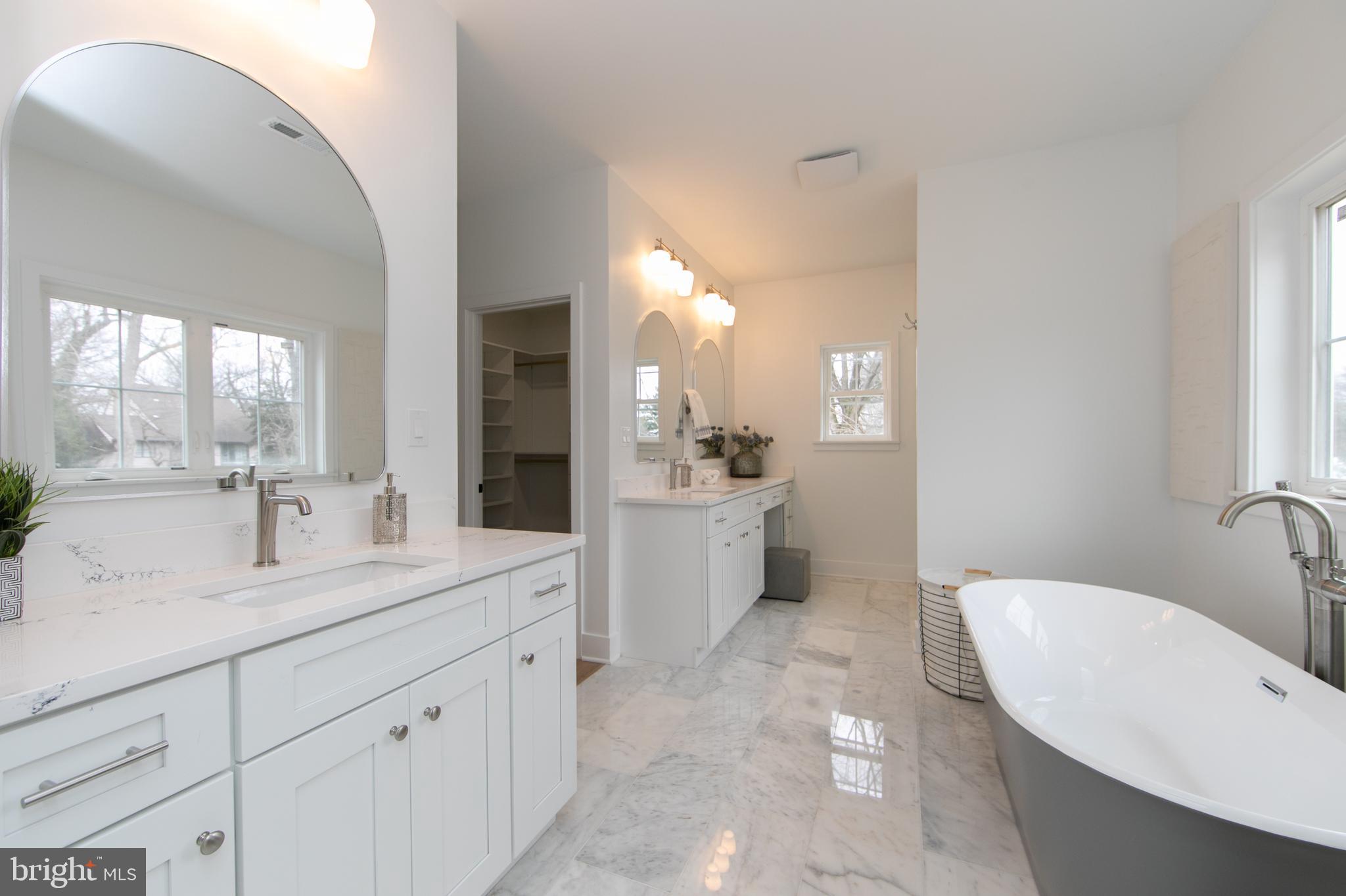 371 Kresson Road Cherry Hill, NJ 08034 - Photo 30 of 51 a spacious bathroom with a bathtub sink and mirror