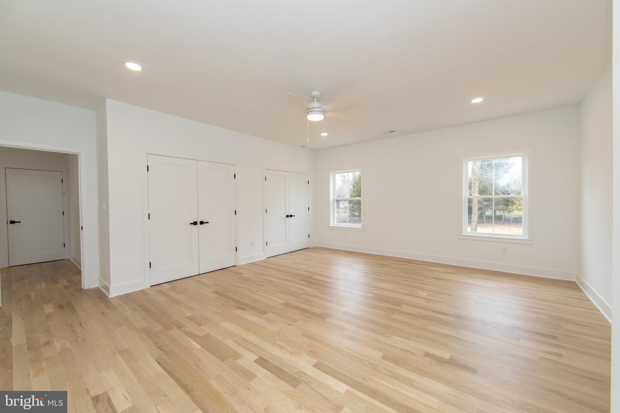 371 Kresson Road Cherry Hill, NJ 08034 - Photo 38 of 51 a view of an empty room with wooden floor and windows