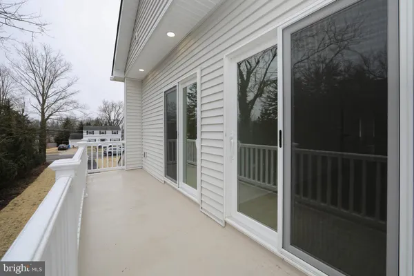 a bathroom with a toilet a sink and a mirror