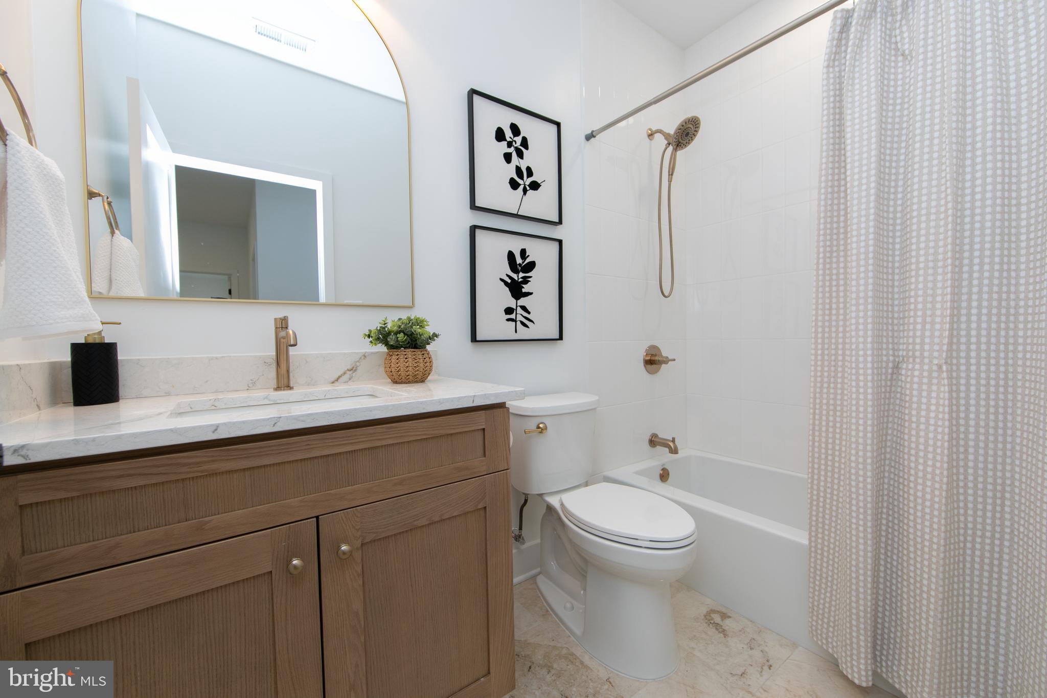 371 Kresson Road Cherry Hill, NJ 08034 - Photo 44 of 51 a bathroom with a toilet a sink and a mirror