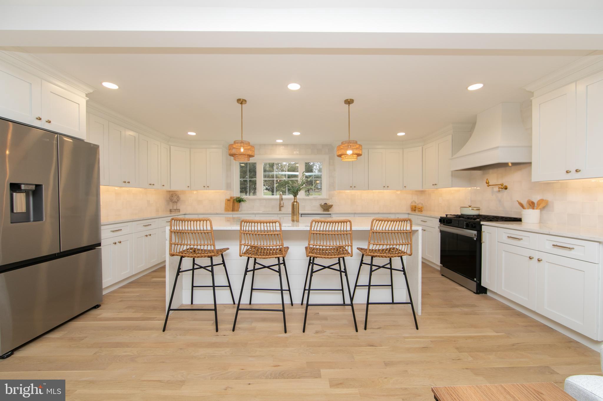 371 Kresson Road Cherry Hill, NJ 08034 - Photo 8 of 51 a kitchen with a dining table chairs stainless steel appliances and cabinets