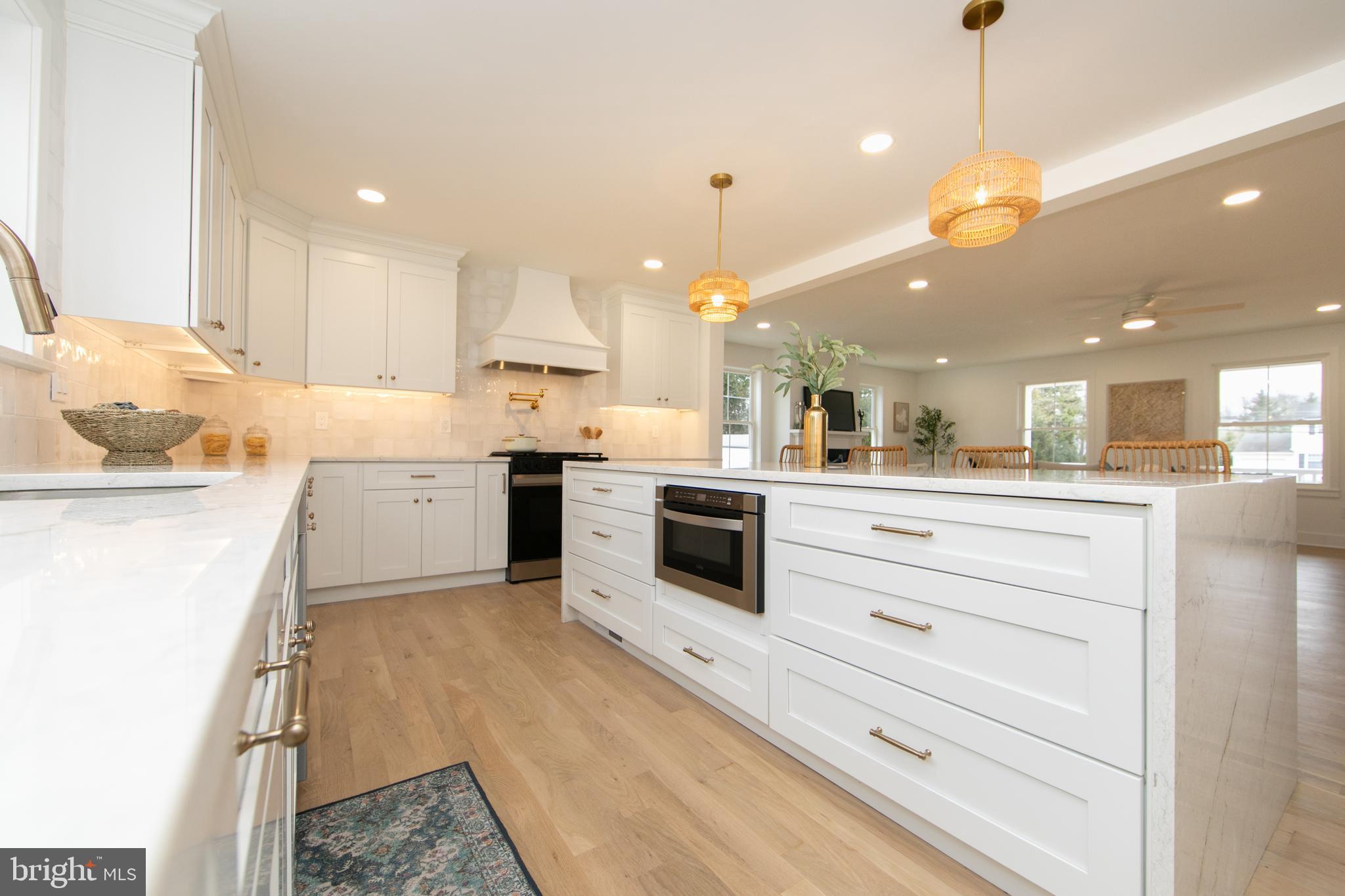 371 Kresson Road Cherry Hill, NJ 08034 - Photo 9 of 51 a kitchen with stainless steel appliances kitchen island granite countertop a stove a sink and a refrigerator