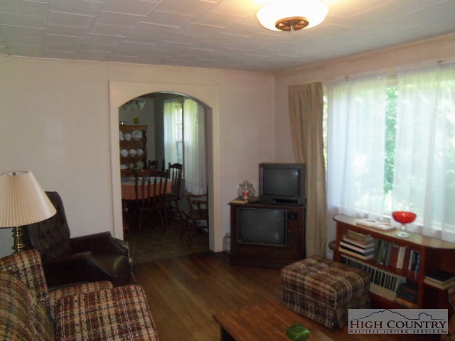 128 Jake Blackburn Road Lansing, NC 28643 - Photo 11 of 16 a living room with furniture rug and a window