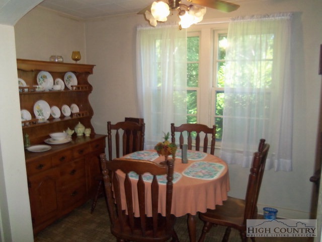 128 Jake Blackburn Road Lansing, NC 28643 - Photo 12 of 16 a view of a dining room with furniture window and outside view