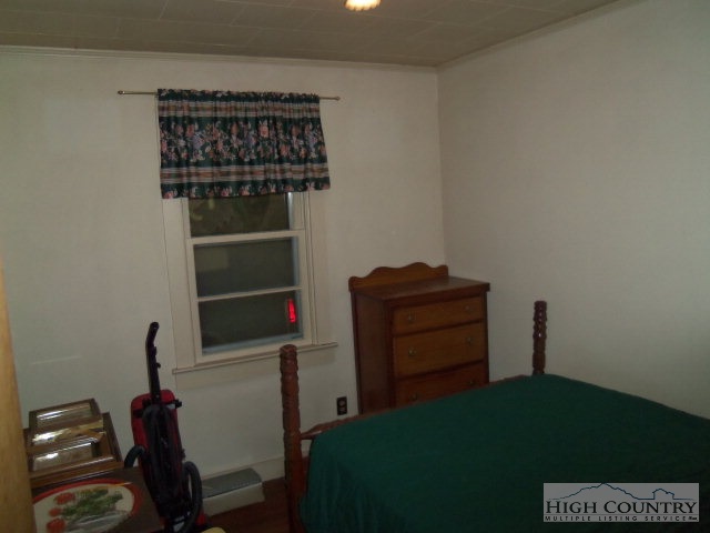 128 Jake Blackburn Road Lansing, NC 28643 - Photo 15 of 16 a room with a dresser and a window