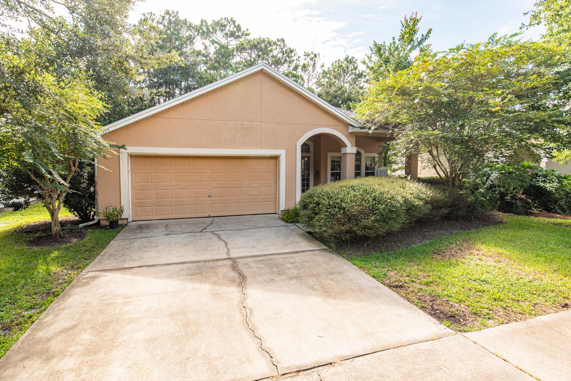 1809 Keswick Road St. Augustine, FL 32084 - Photo 1 of 39 a front view of house with yard and trees around