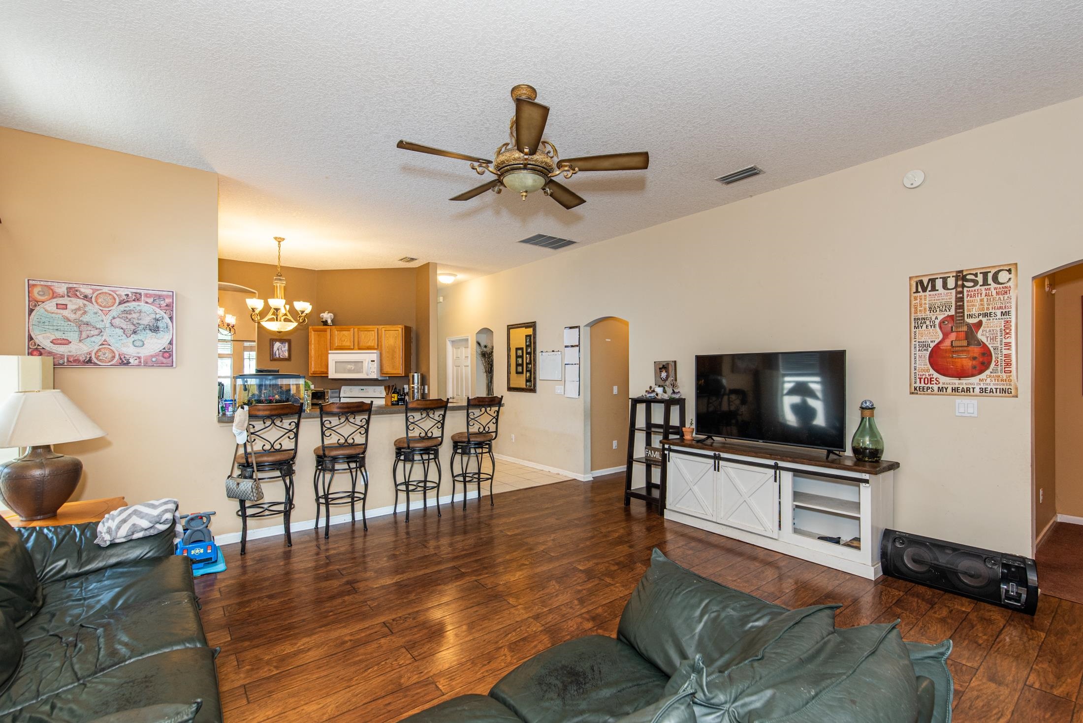 1809 Keswick Road St. Augustine, FL 32084 - Photo 11 of 39 a living room with furniture and a flat screen tv