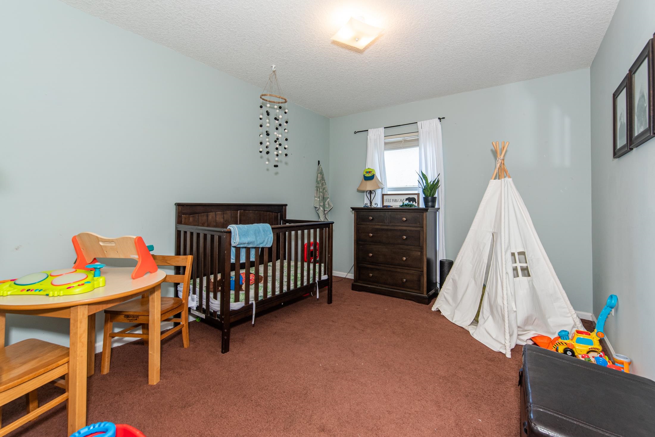 1809 Keswick Road St. Augustine, FL 32084 - Photo 15 of 39 a bedroom with furniture and a window