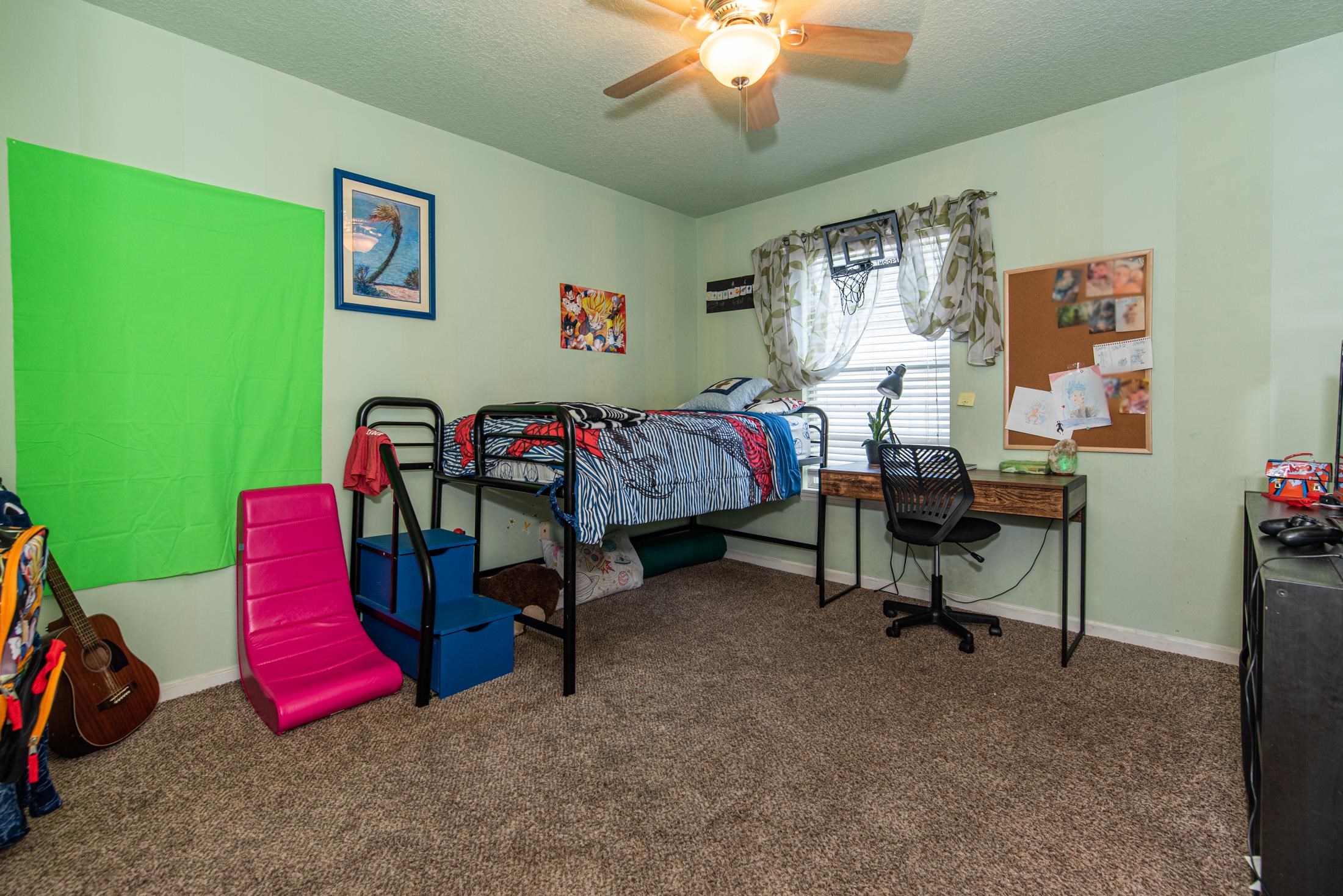 1809 Keswick Road St. Augustine, FL 32084 - Photo 18 of 39 a bedroom with a bed and a chandelier