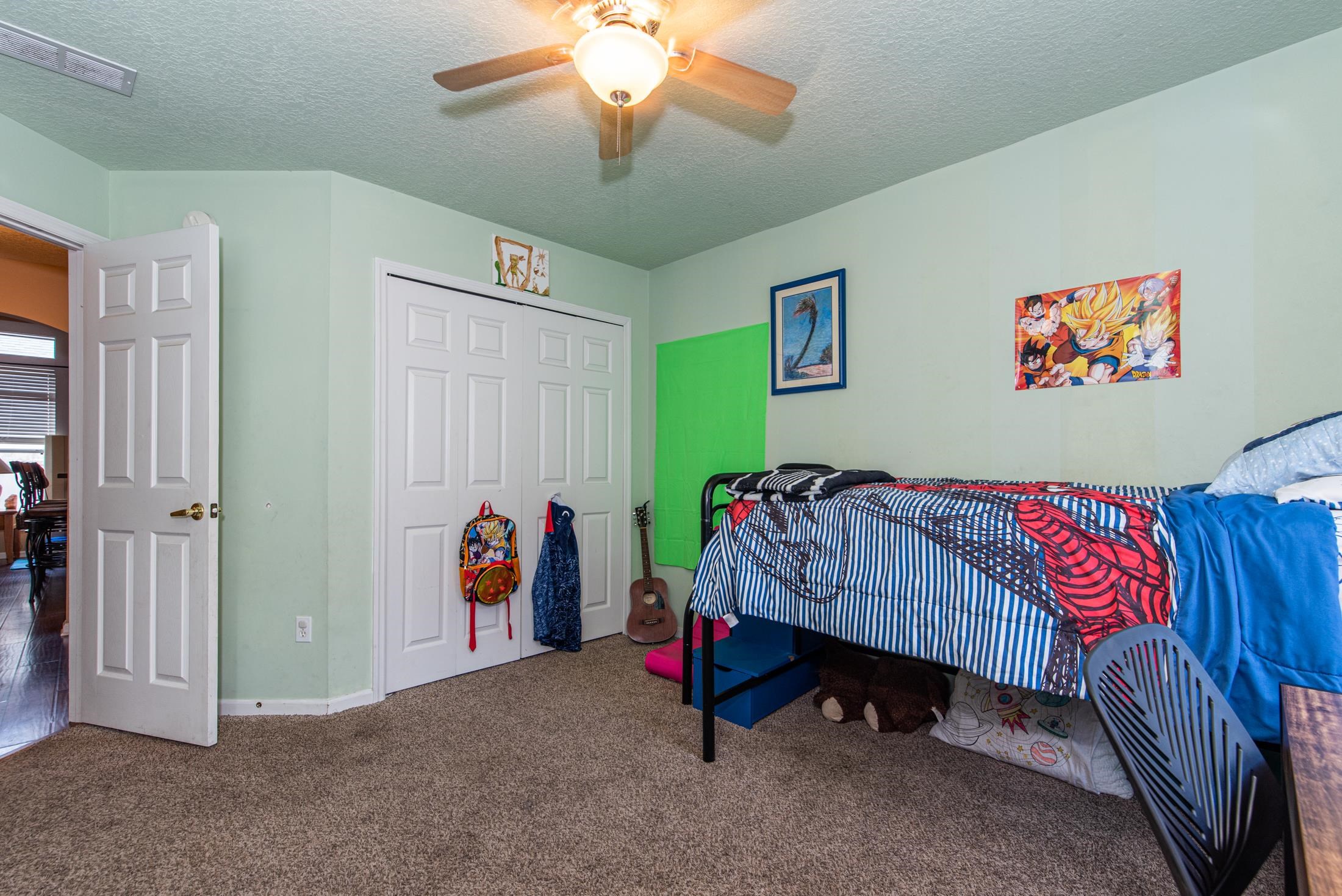 1809 Keswick Road St. Augustine, FL 32084 - Photo 19 of 39 a bedroom with furniture and a chandelier