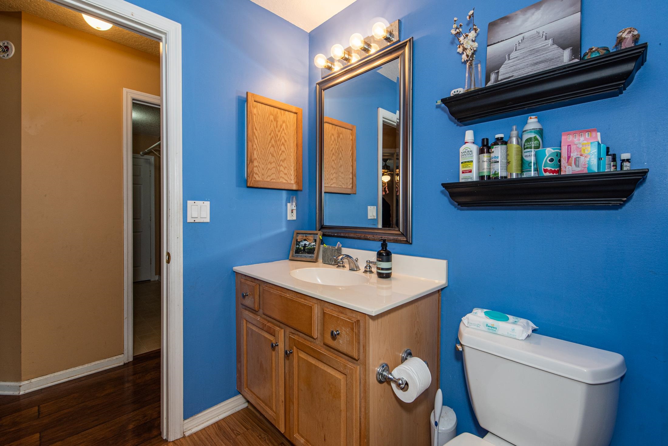 1809 Keswick Road St. Augustine, FL 32084 - Photo 21 of 39 a bathroom with a toilet a sink and mirror