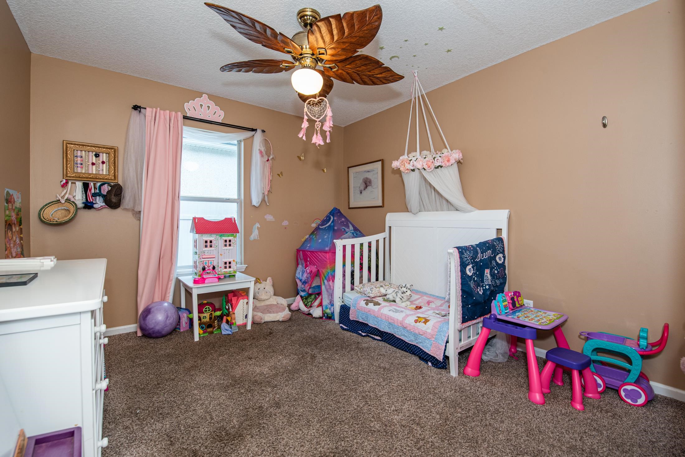 1809 Keswick Road St. Augustine, FL 32084 - Photo 23 of 39 a bedroom with bed and a chandelier