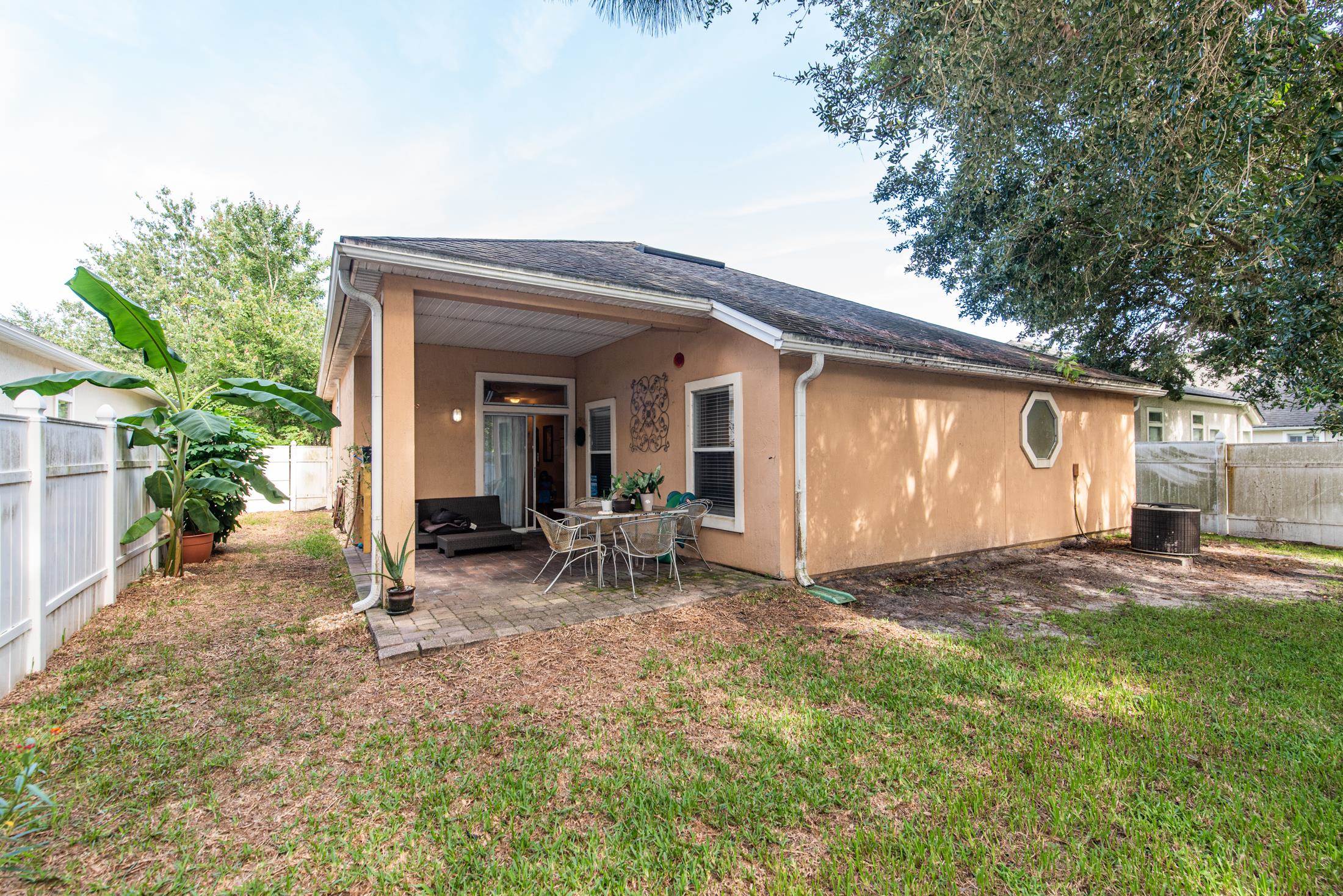 1809 Keswick Road St. Augustine, FL 32084 - Photo 27 of 39 a view of a house with backyard porch and sitting area