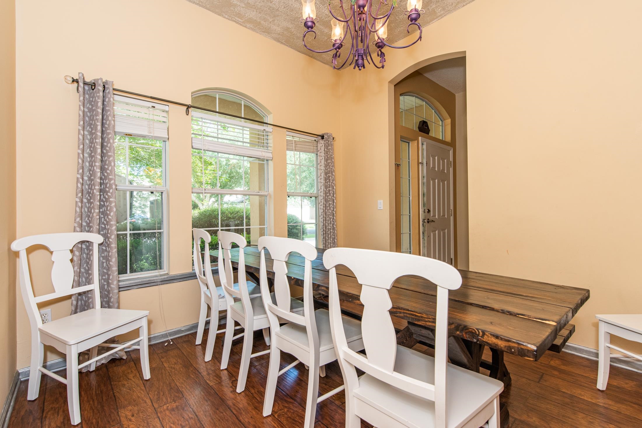 1809 Keswick Road St. Augustine, FL 32084 - Photo 4 of 39 a view of a dining room with furniture wooden floor and chandelier