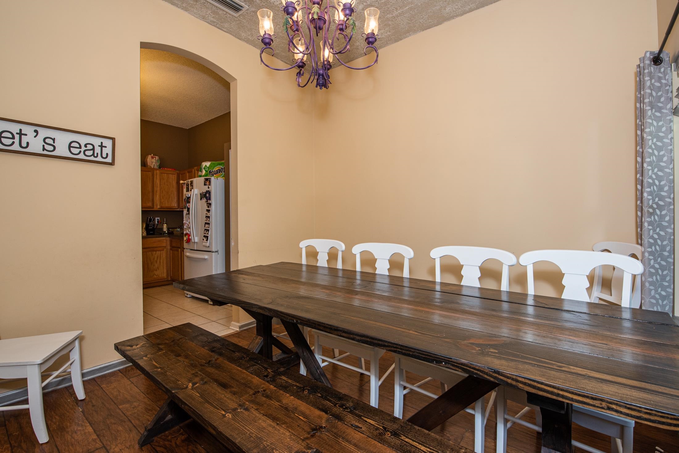 1809 Keswick Road St. Augustine, FL 32084 - Photo 5 of 39 a view of a dining room with furniture and wooden floor