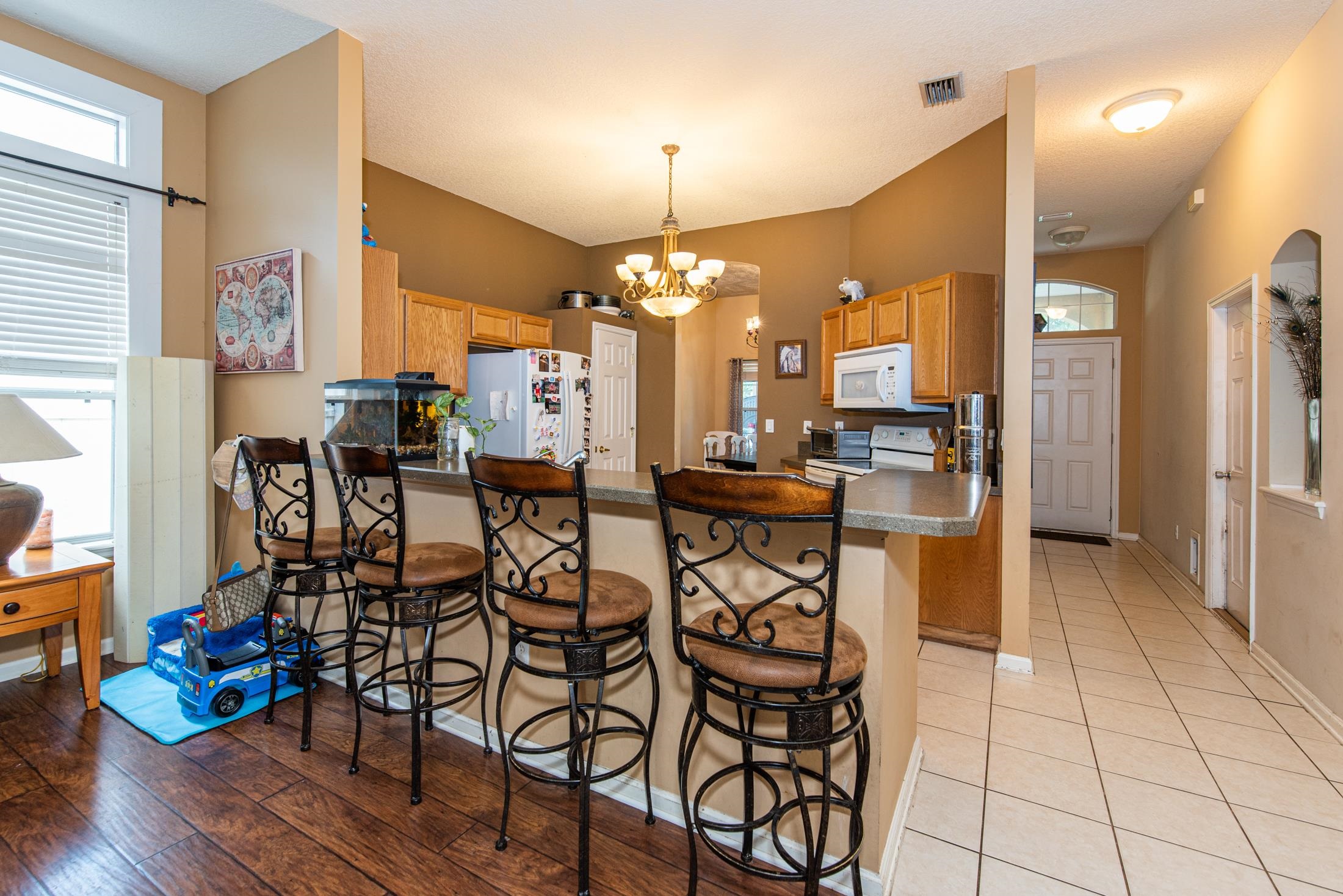 1809 Keswick Road St. Augustine, FL 32084 - Photo 6 of 39 a view of a dining room with furniture and wooden floor