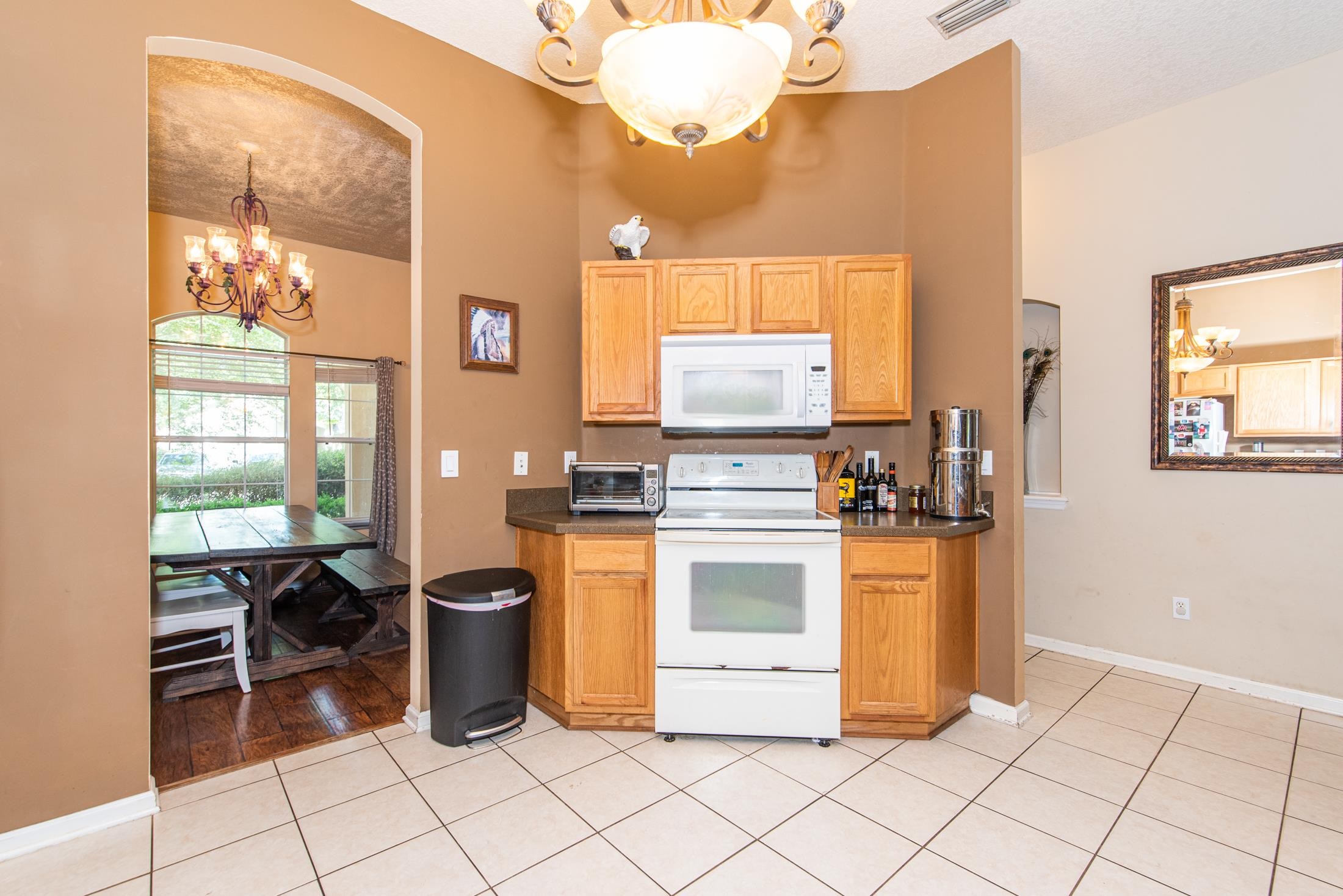 1809 Keswick Road St. Augustine, FL 32084 - Photo 8 of 39 a kitchen with a stove a sink and a refrigerator