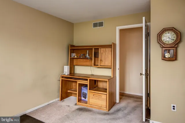 a workspace with furniture and window