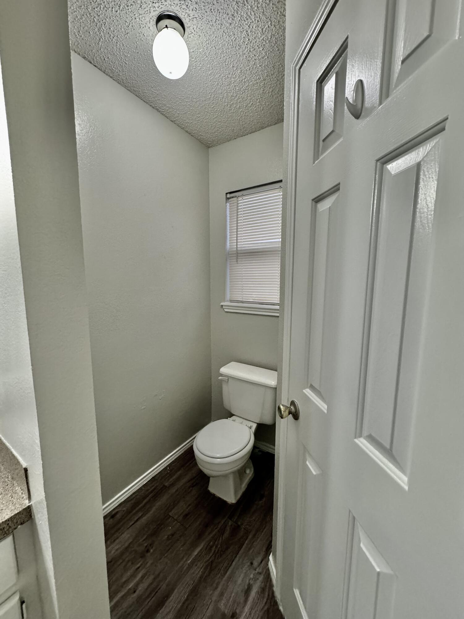 1003 Juneau Avenue Lubbock, TX 79416 - Photo 13 of 21 a bathroom with a toilet