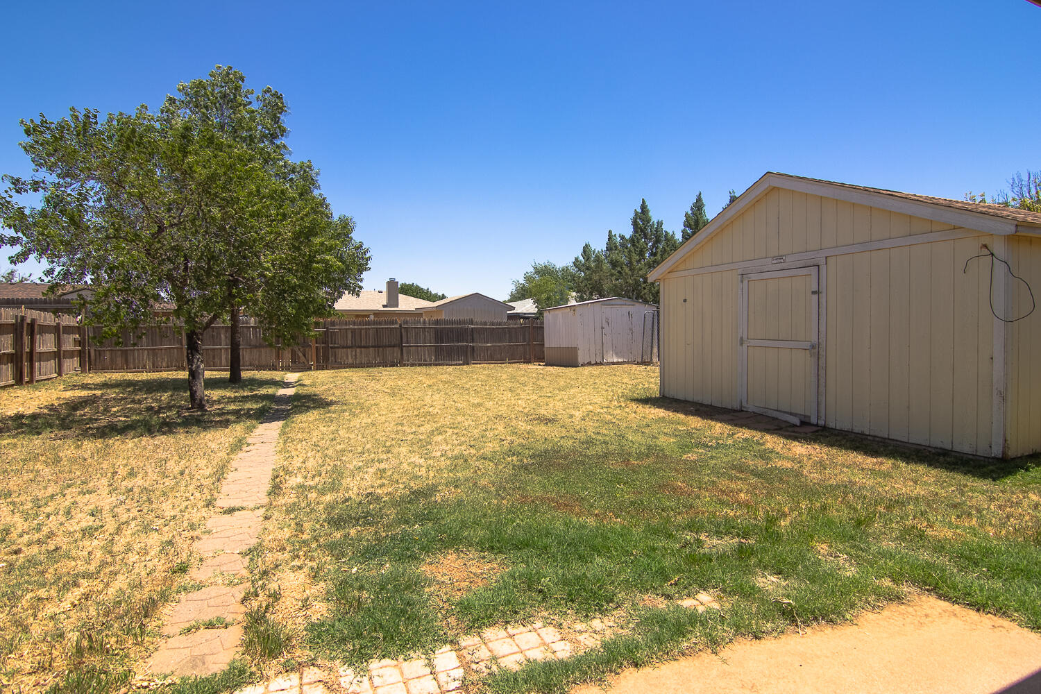 1003 Juneau Avenue Lubbock, TX 79416 - Photo 19 of 21 a view of a backyard