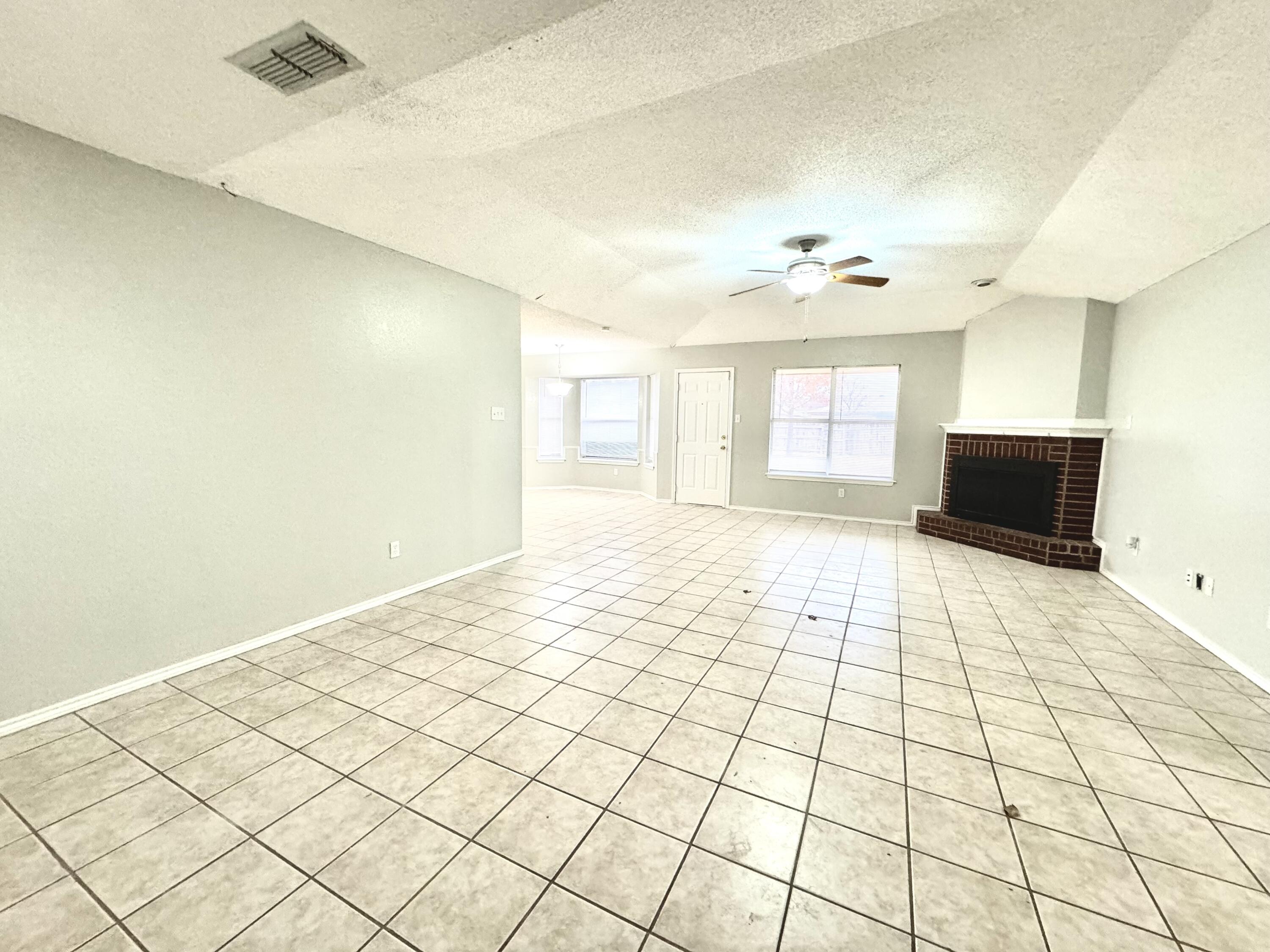 1003 Juneau Avenue Lubbock, TX 79416 - Photo 3 of 21 a view of an empty room and window